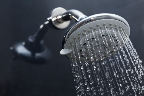 35466776 - shower head in bathroom with water drops flowing